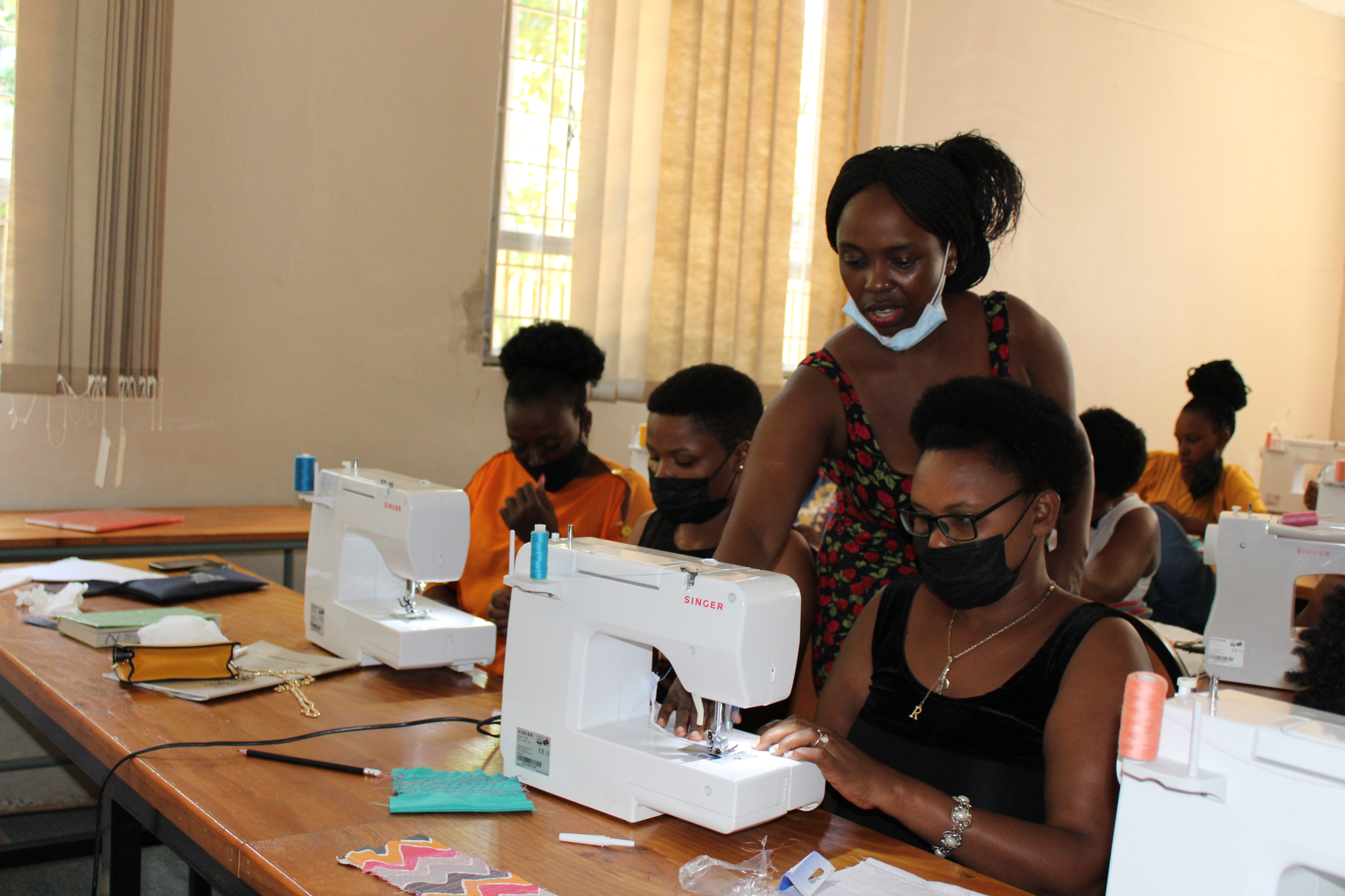 Migrants and local women share skills and knowledge on Sewing and Fashion designing